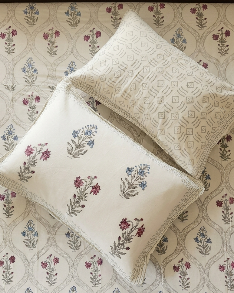 White Arka Luxe Cotton bedsheet featuring handblock floral print with matching pillow covers