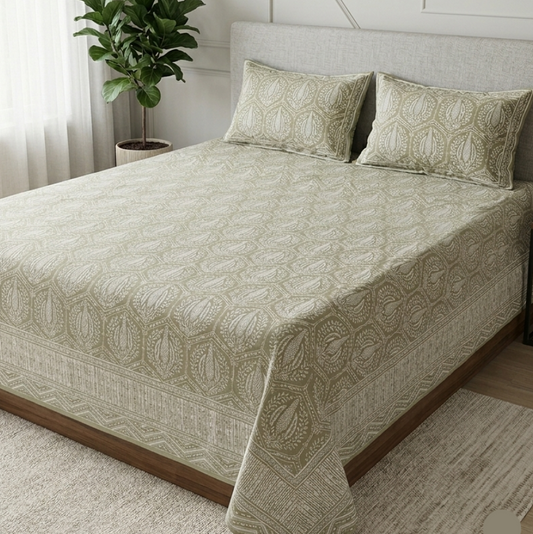 Bed with patterned bedding in a bedroom setting