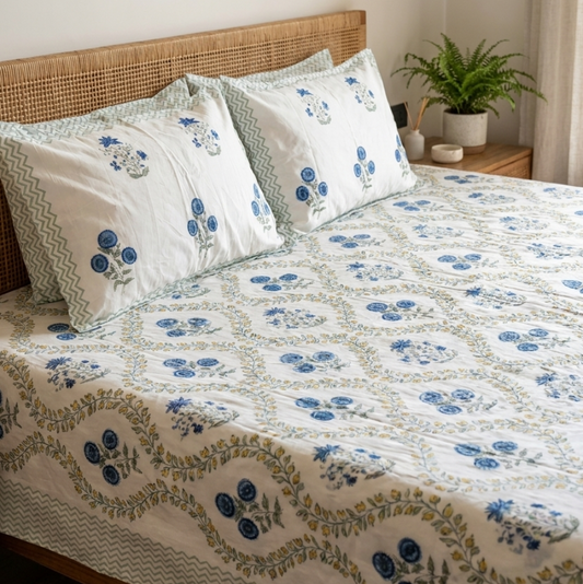 Matching pillow covers with blue floral motifs and coordinating border from the LATA Arka Luxe Cotton bedsheet set.