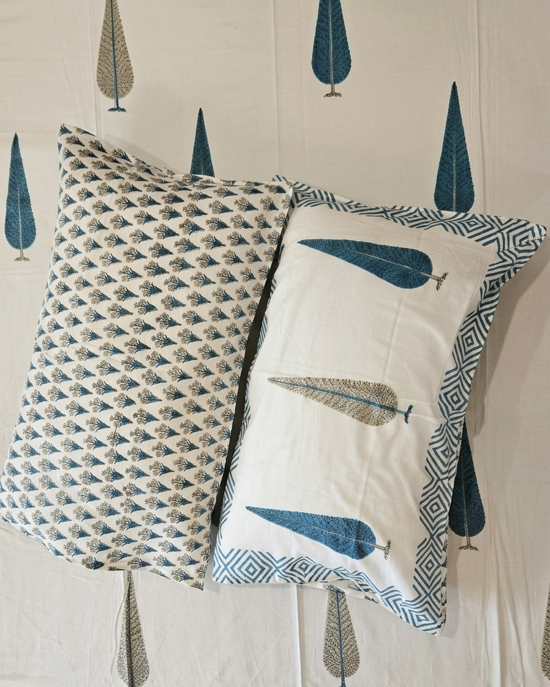 Matching pillow covers and geometric border detail of the Mallika Blue Leaf Arka Luxe Cotton Super King bedsheet