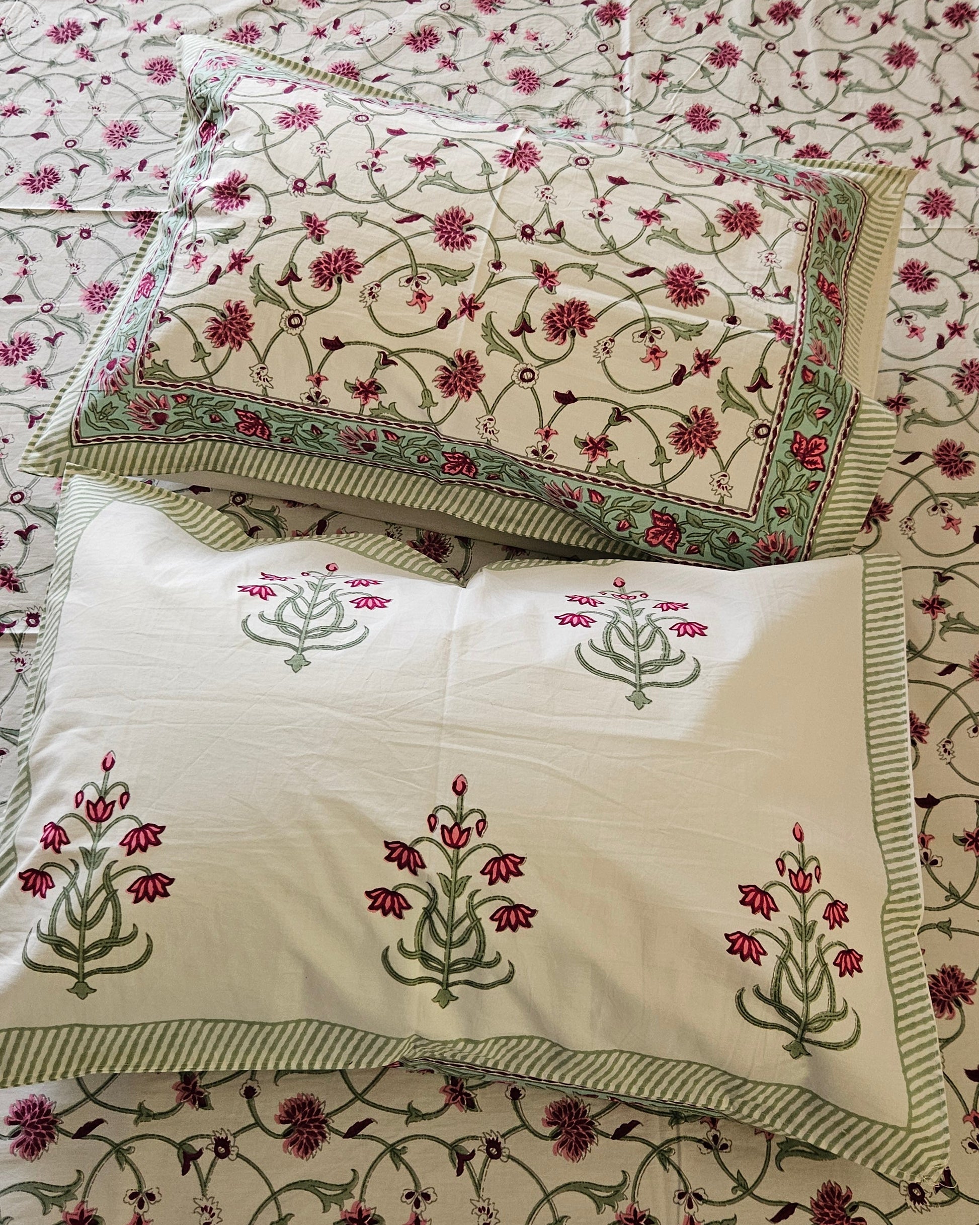 Close-up of the Pink Floral Arka Luxe Cotton bedsheet showcasing the delicate floral vine pattern and luxurious 500 TC fabric.